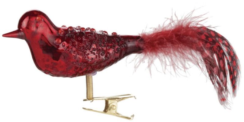 This red glass cardinal ornament has feathers on its tail and clips 