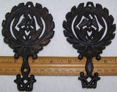 You will be purchasing 2 black cast iron vintage trivets. 5 1/4 eagle 